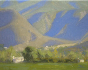 Ojai Mountain Shadows, giclee print by Dan Schultz. Large mountains with blue and violet shadows rise behind a green foreground.