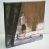 Blanket of Snow, giclee print by Dan Schultz. Young woman in a white coat outdoors in a snowy landscape.