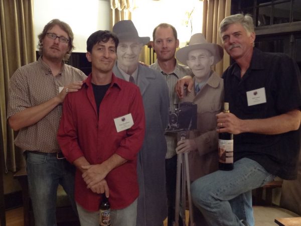 Josh Been, Dave Santillanes, Dan Schultz and Bill Cramer posing with the Kolb Brothers in Kolb Studio at Grand Canyon National Park.