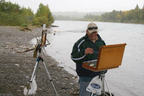 Hermann Brandt shivering while we painted the Bow River from underneath a bridge. He looks happy at least!