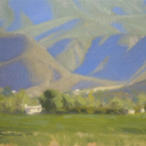 Ojai Mountain Shadows, giclee print by Dan Schultz. Large mountains with blue and violet shadows rise behind a green foreground.