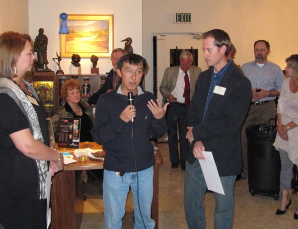 Quang Ho presents first place award to Dan Schultz at the American Impressionist Society 10th Annual National Show at Saks Gallery in Denver, Colorado.