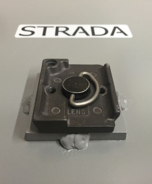 Quick-release tripod mount on the bottom of the Strada Pad.