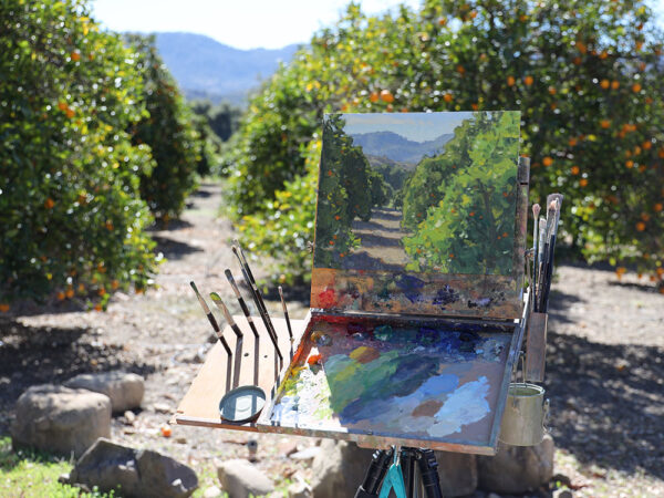 Plein air painting by Dan Schultz in an Ojai citrus orchard.